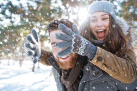 couple playing snow in snowy mountain at Cutarelli Vison