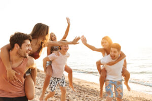 group of people high five at side walk beach