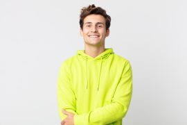 man happy wearing yellow jacket