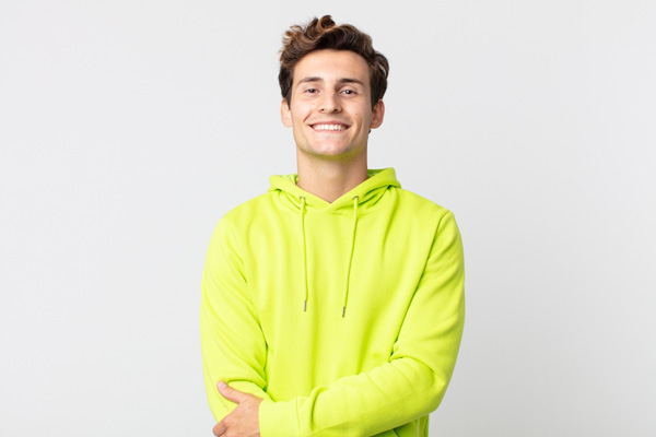 man happy wearing yellow jacket