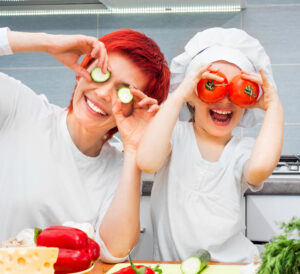 mother and daughter having fun with food