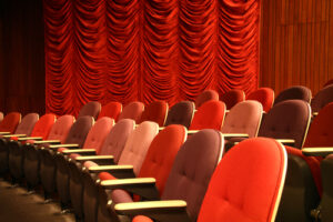 row of seats in an empty theater