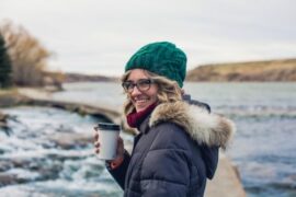 Woman Enjoying Coffee in the Fall