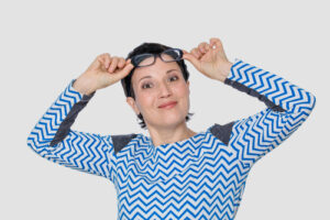 satisfied woman on her eyeglass from Cutarelli Vision