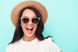 Happy woman with a hat and sunglasses