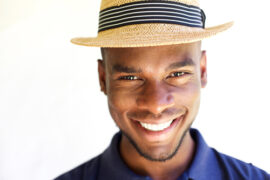 Happy young man wearing a hat