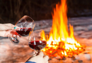 wine toasting at bonfire
