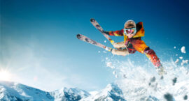 young man skier jumping on extreme winter sports