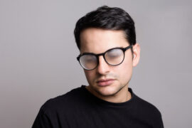 young man wearing black shirt with foggy glasses